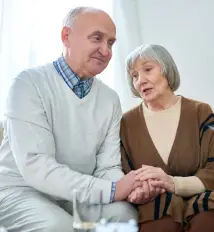 Home 3 Older adults leaning into each other after therapy
